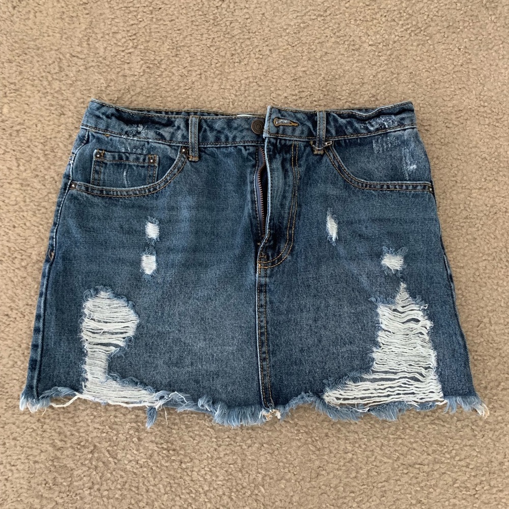 Distressed denim mini skirt